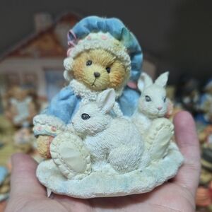 This is a Cherished Teddies Sonja "Holiday Cuddles" figurine by Enesco.
